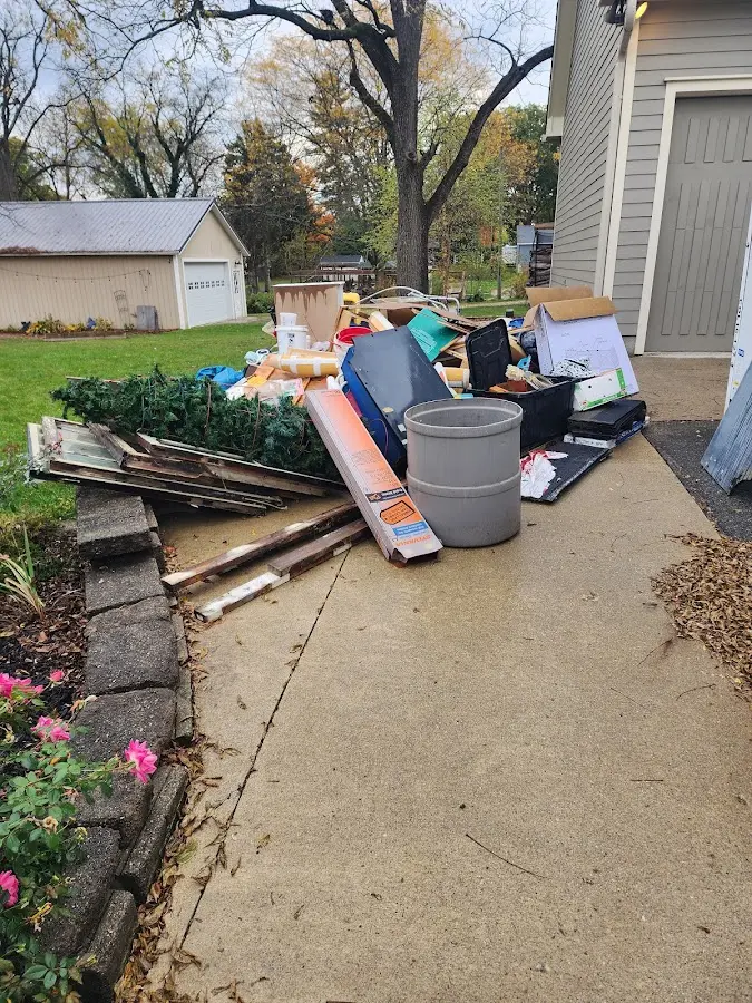 Dumpster being loaded with debris for 30 Yard Dumpster Rental in Brookdale